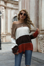 Chromatic blocked crewneck knit sweater with brown, white, and rust stripes. Acrylic.