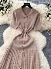 Apricot knit Peter Pan collar dress with gold buttons and short sleeves.