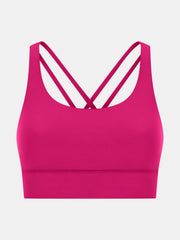 Hot pink performance bra with crisscross back straps and a wide band.