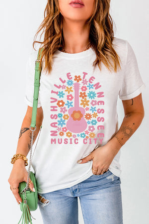 White t-shirt with Nashville Music City graphic featuring a pink guitar and colorful flowers