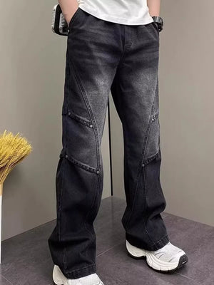 Distressed black wide-leg jeans for men with panel detailing and a vintage wash.