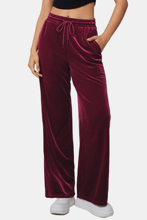 Burgundy velvet palazzo lounge trousers with drawstring waist and pockets