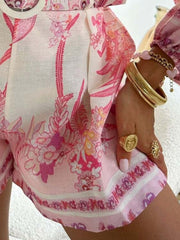 Pink floral print button-up shirt and shorts set with a casual, chic style.