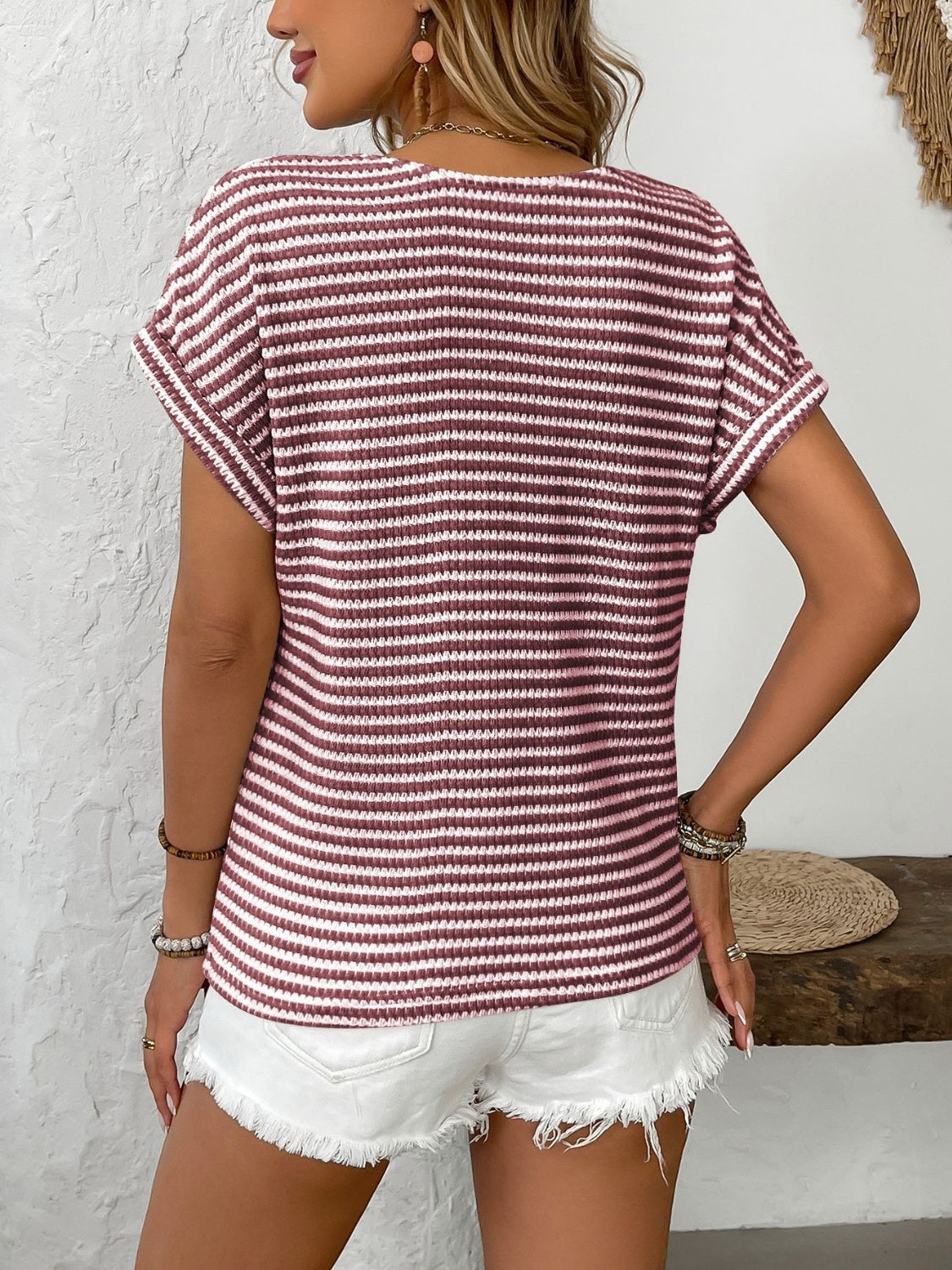 Button-down knit top with breton stripes in burgundy and white, short sleeves.
