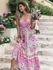 Pink floral print viscose maxi dress with drawstring waist and tassel details.