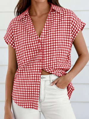 Red gingham print button-down shirt with short sleeves and a collared neckline.
