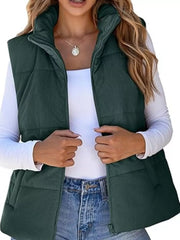 Green corduroy zip-up vest coat with quilted detail and high collar.