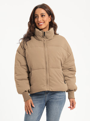 Padded bomber jacket in camel with a stand collar, zip front, and ribbed cuffs.