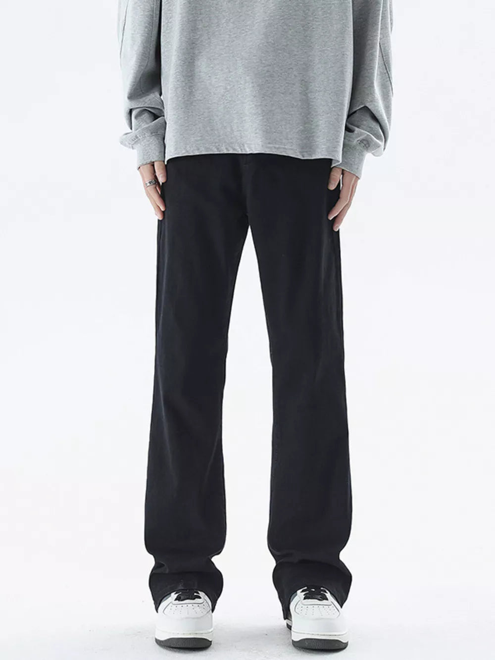 Black relaxed fit cotton jeans for men with a straight leg cut.