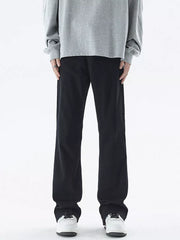 Black relaxed fit cotton jeans for men with a straight leg cut.