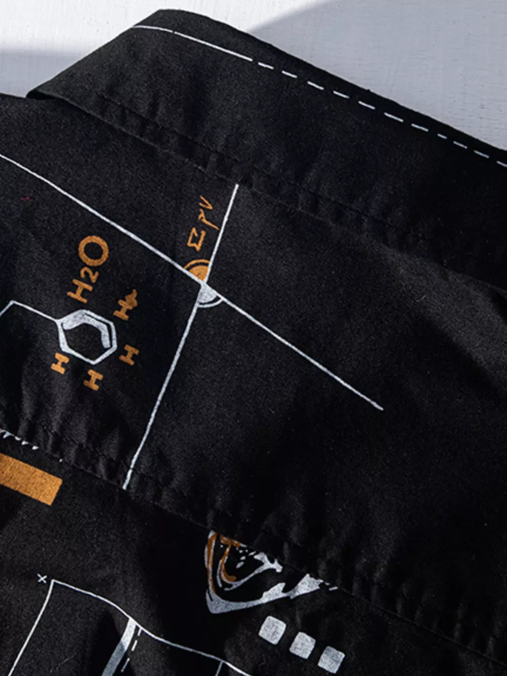 Black cotton blend long johns with white and gold science graphic print