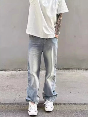 Relaxed fit light wash wide leg jeans with distressed details and a cotton blend.