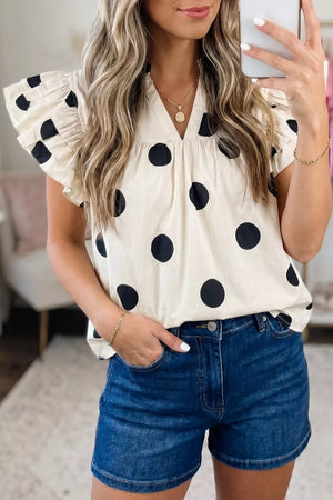 Cream cotton V-neck shirt with black polka dots and ruffled short sleeves