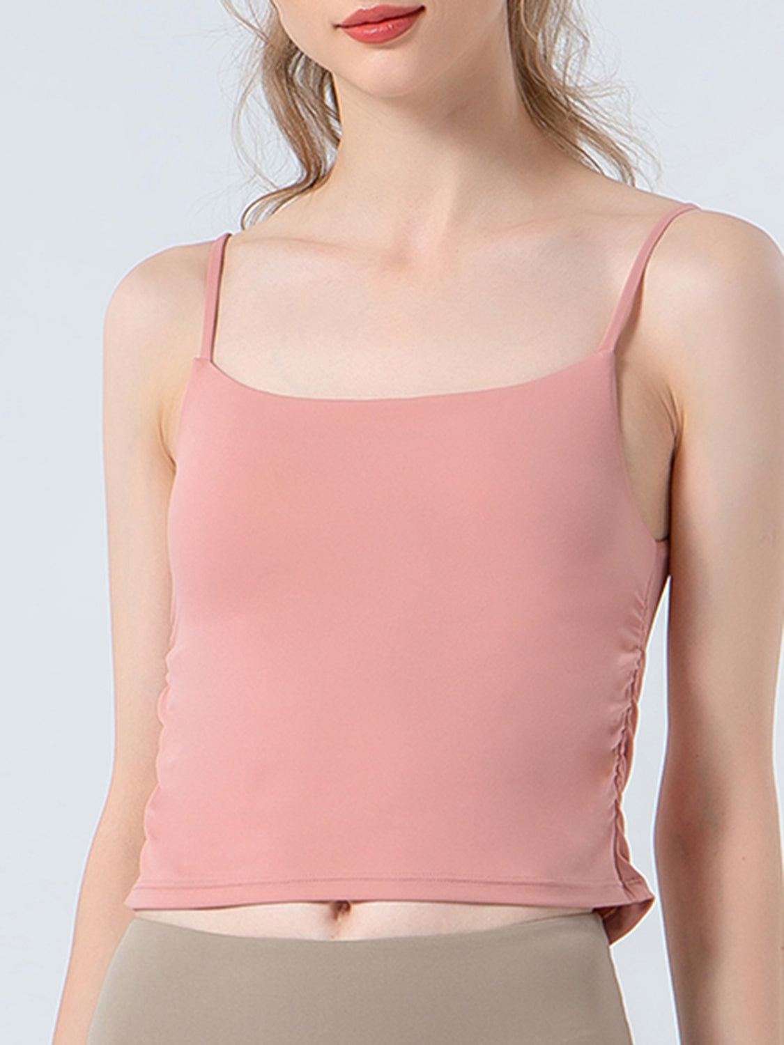 Dusty Pink tank top with spaghetti straps and side ruching detail.