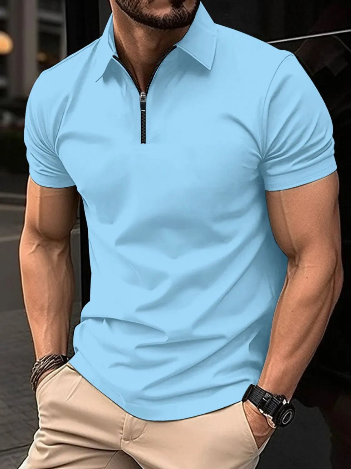 Sky blue zip-neck polo shirt with short sleeves and a modern tailored fit.