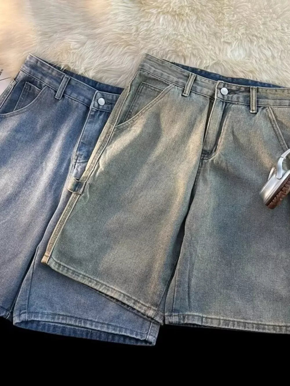 Men's high-waisted wide-leg denim shorts in blue tones with a relaxed fit.