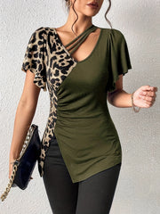Moss green asymmetric top with leopard print panel, ruched side, and cutout neckline.