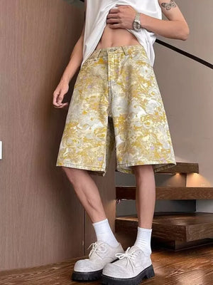 Floral print wide-leg denim shorts in yellow and white, made of 100% cotton.