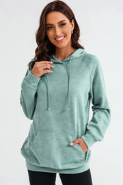 Textured raglan sleeve hoodie in Gum Leaf green with drawstring hood and front pocket.
