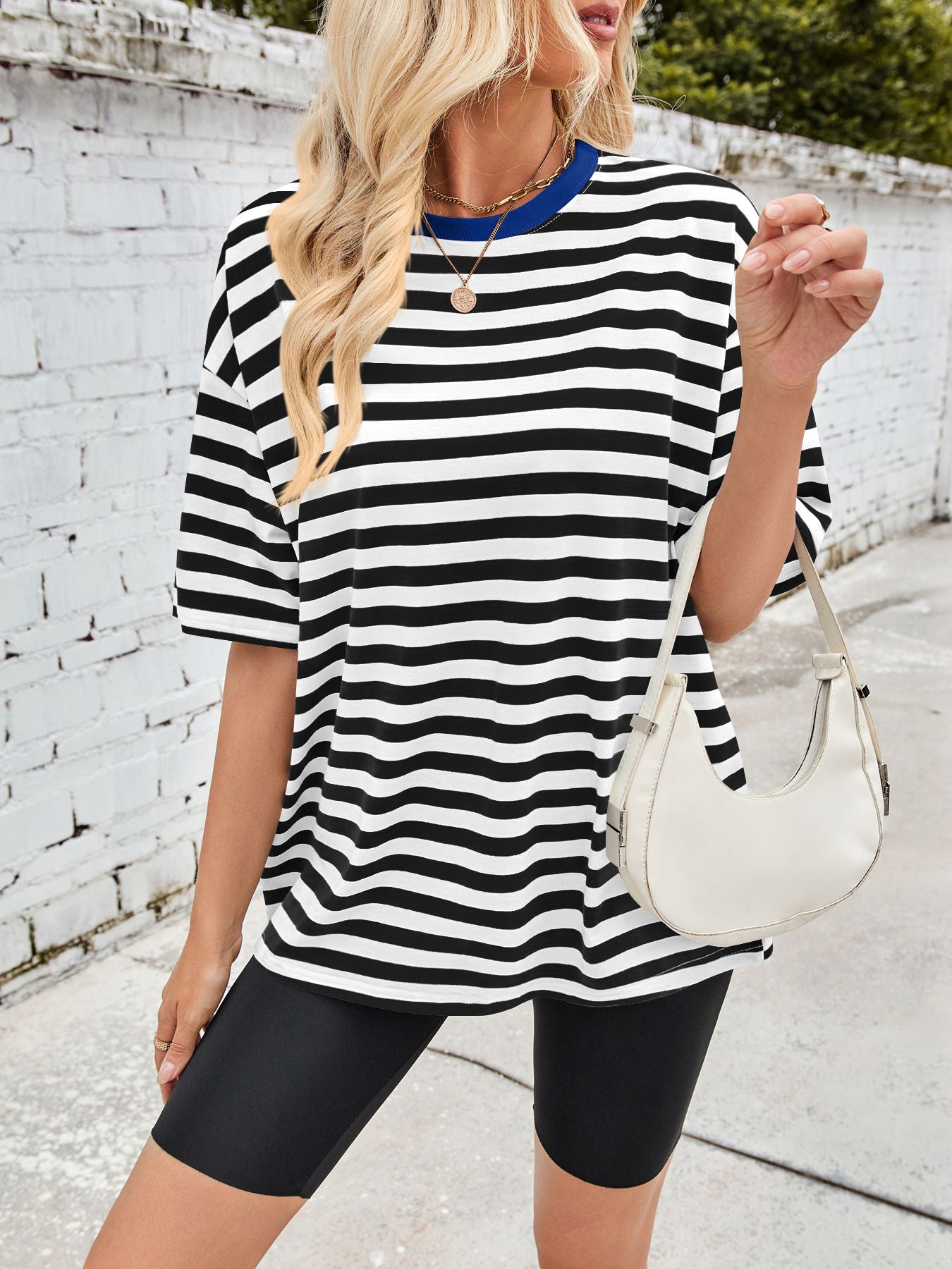 Relaxed fit striped t-shirt with contrast blue trim and short sleeves.