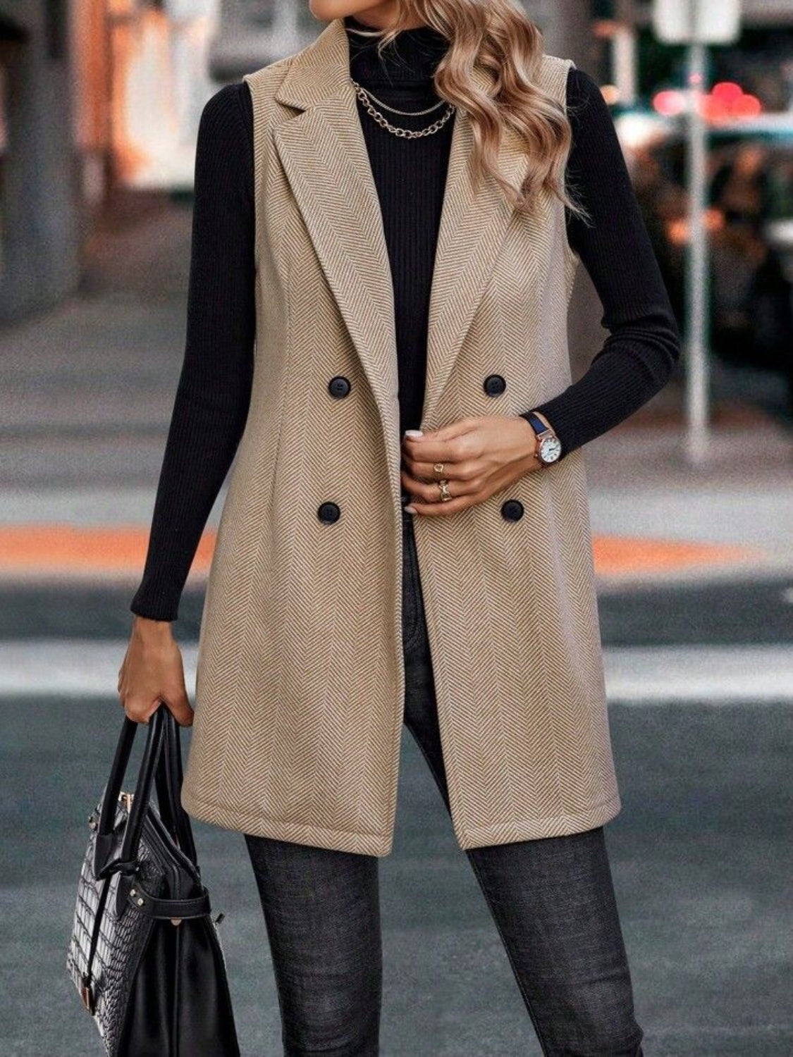 Khaki herringbone double-breasted tailored vest with a collared neckline and buttoned front.