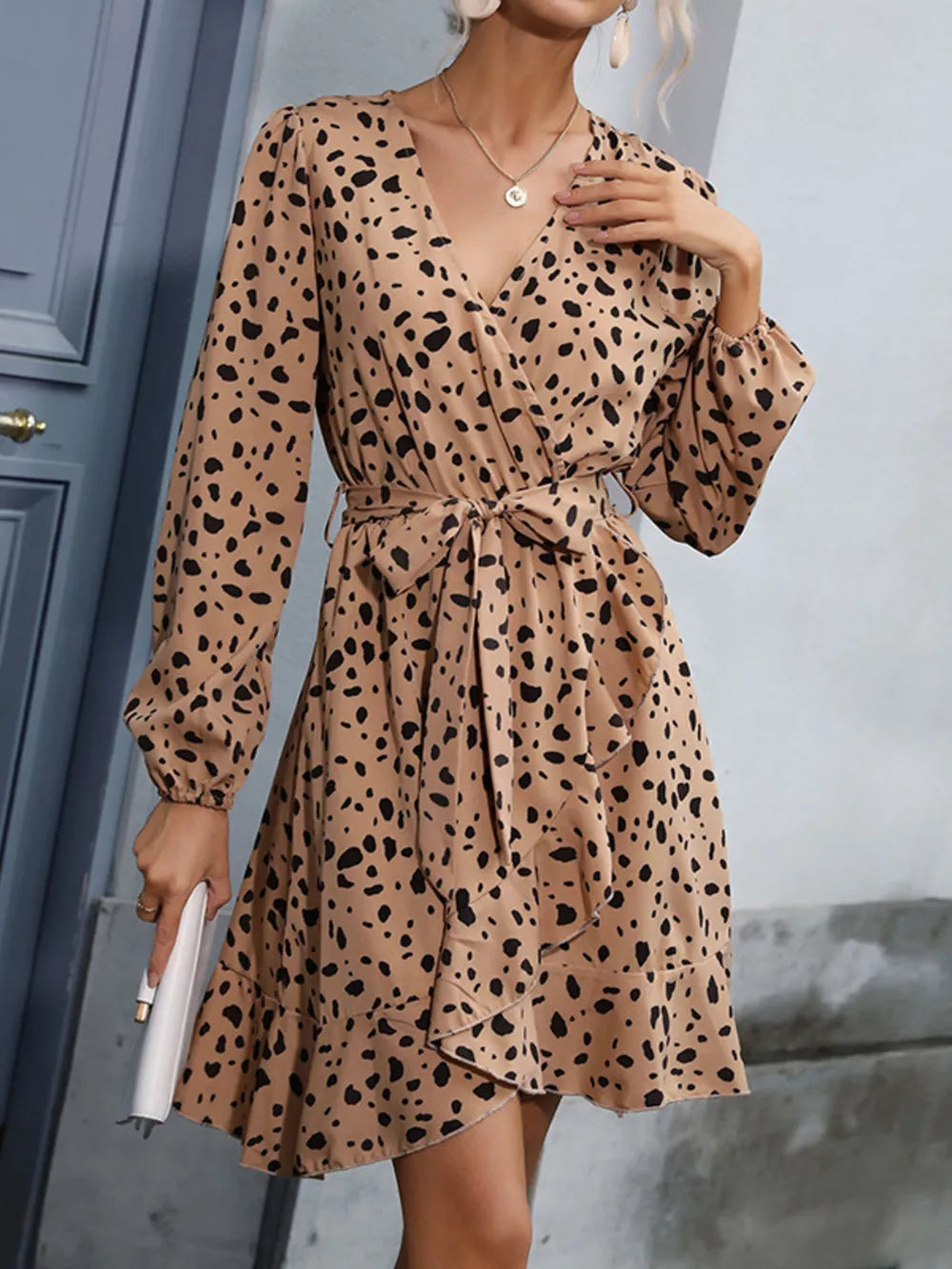 Leopard print v-neck mini dress with tie waist and ruffled hem