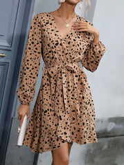 Leopard print v-neck mini dress with tie waist and ruffled hem