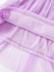 Lavender tulle toddler dress with cotton lining and detailed stitching.