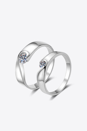 Curved Embrace diamond ring set in silver with a single stone on each ring.