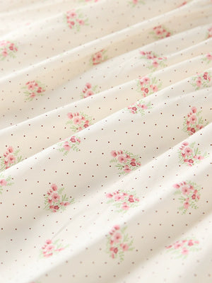 Cream cotton toddler dress with pink floral and polka dot print