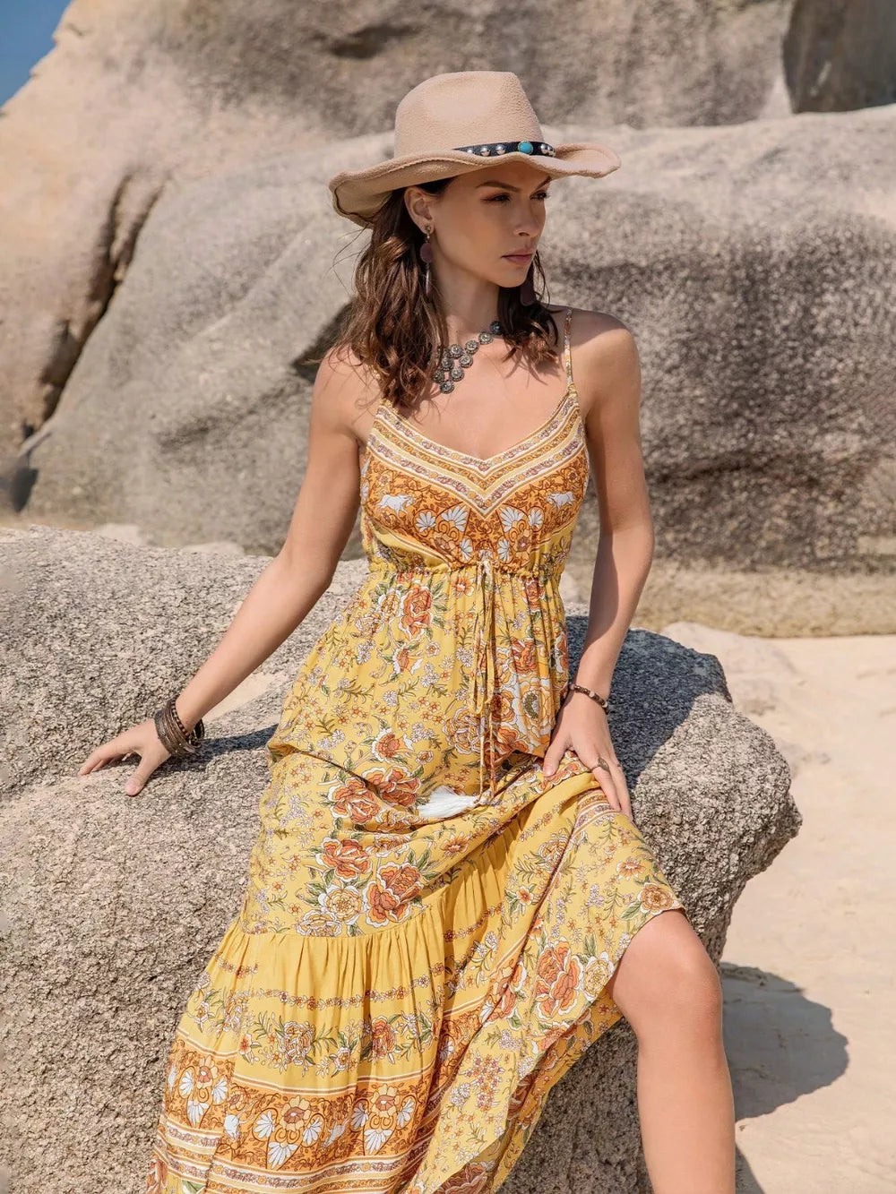 Yellow floral tiered cami maxi dress with tassel detail and V-neck.