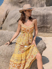 Yellow floral tiered cami maxi dress with tassel detail and V-neck.