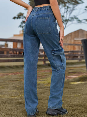 Utility denim straight leg cargo pants in medium wash blue with multiple pockets.