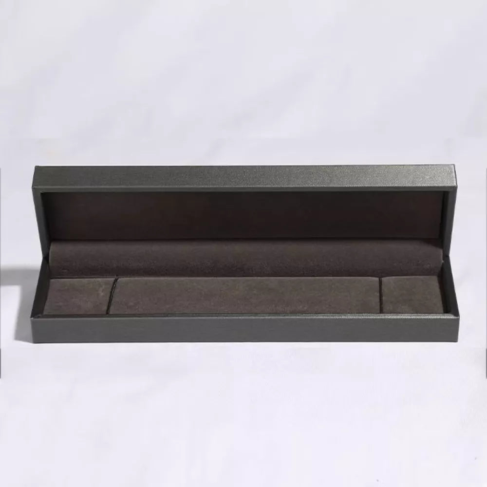 Open dark gray jewelry box with velvet lining for bracelets