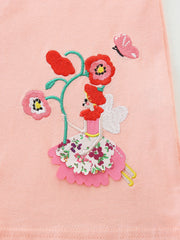Toddler dress with whimsical fairy and floral embroidery on pink cotton.