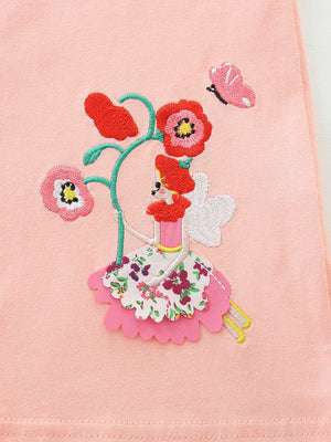 Toddler dress with whimsical fairy and floral embroidery on pink cotton.