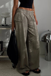 Utility buckle flared denim trousers in dark gray with wide legs and cargo pockets.