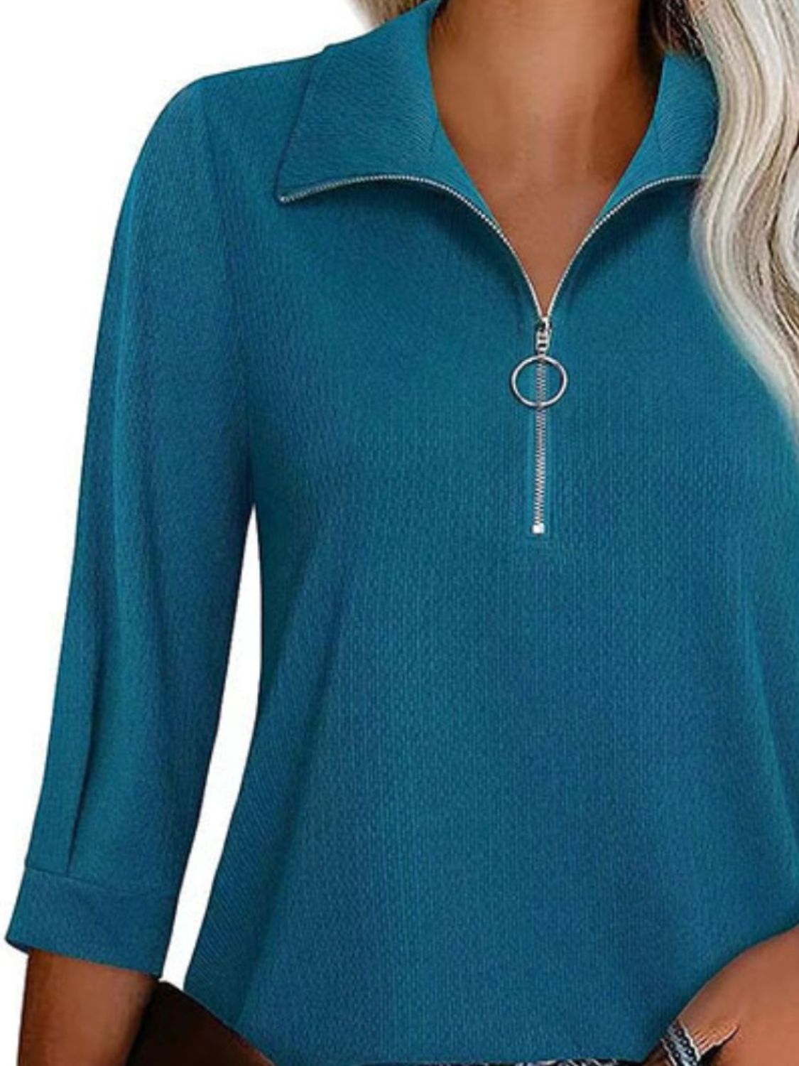 Peacock blue textured zip-front polo top with a ring pull zipper and collar.