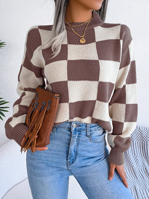 Checkerboard knit mock neck pullover sweater in camel and white acrylic with ribbed cuffs and hem.