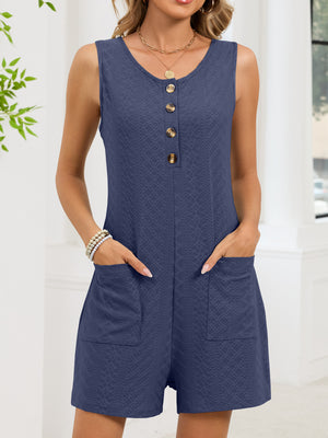 Navy sleeveless romper with button front and textured fabric, featuring patch pockets.