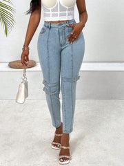 Light wash denim jeans with buckle strap accents on the legs.