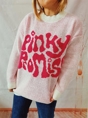 Blush pink knit jumper with pink "pinky promise" graphic and cream neckline and cuffs.