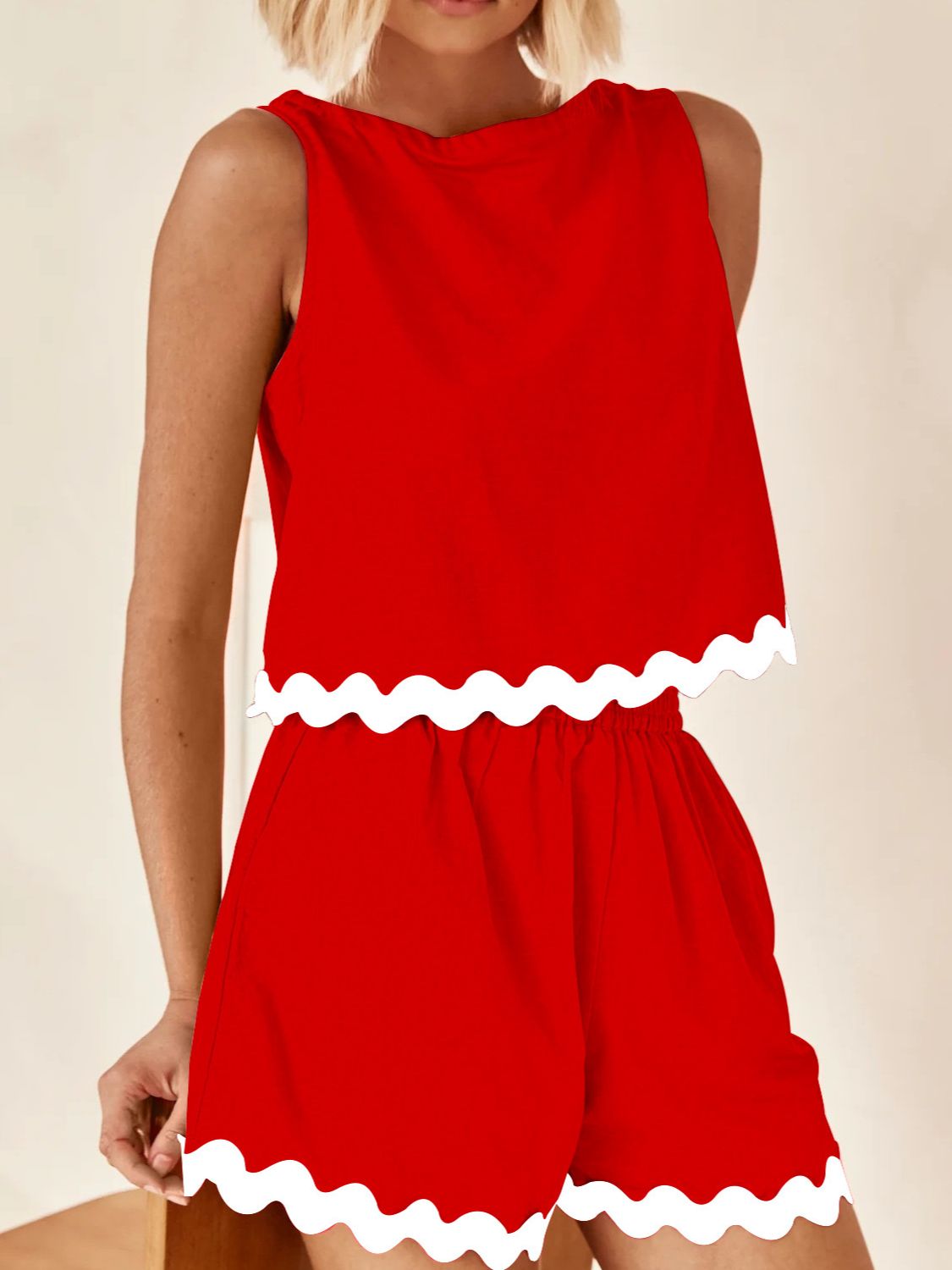 Scalloped edge tank and shorts set in scarlet red with white trim.