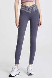 Dark Gray Angel Band active leggings with a V-waistband and logo detail.