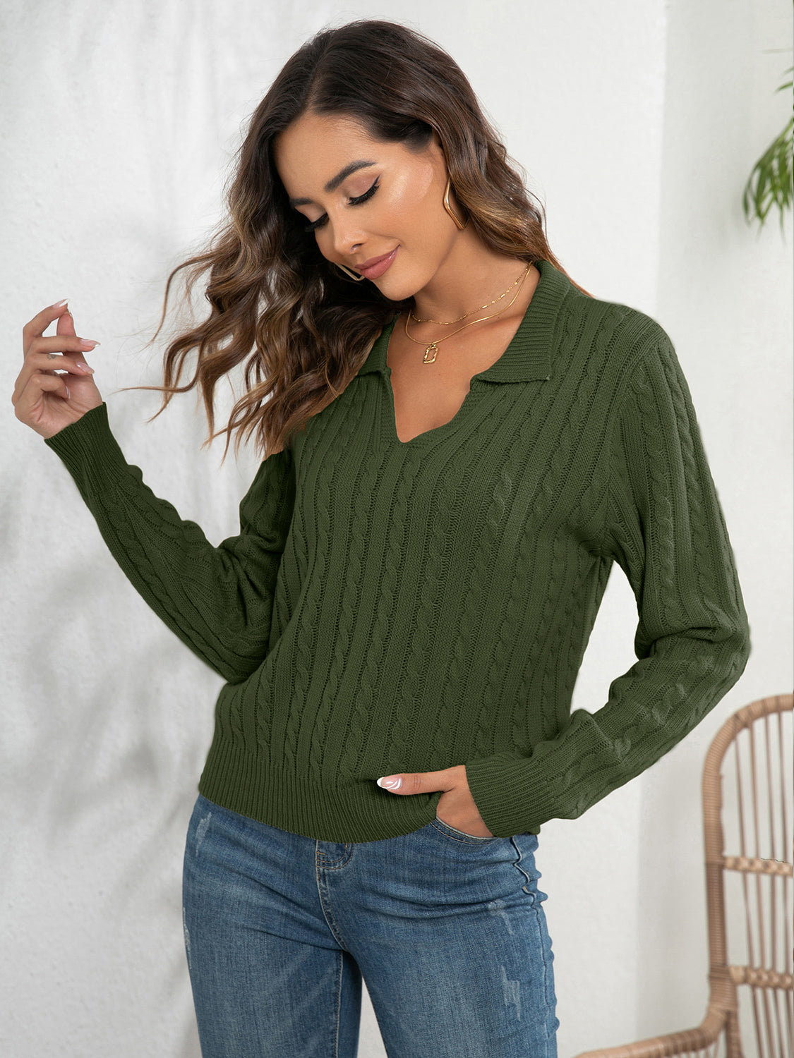 Army green cable knit polo neck jumper with V-neck and long sleeves.