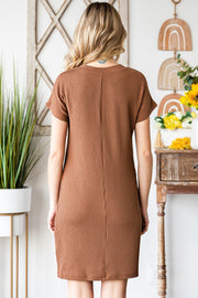 Caramel ribbed knit t-shirt dress with short sleeves and a straight cut.