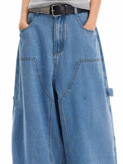 Classic wide-leg jeans in blue wash denim with angular pockets and a relaxed fit.