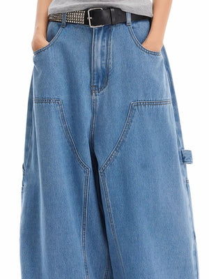 Classic wide-leg jeans in blue wash denim with angular pockets and a relaxed fit.