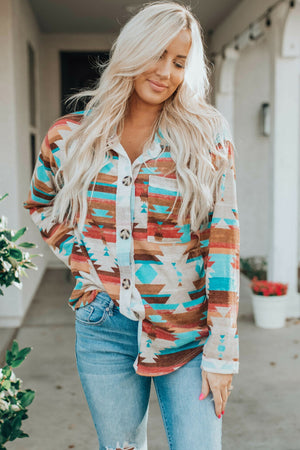 Southwestern print button-down blouse with a multicolor geometric pattern and buttoned front.