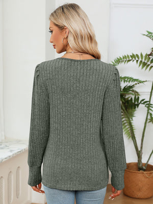 Moss ribbed knit sweater with crochet trim detail on shoulders and cuffs.